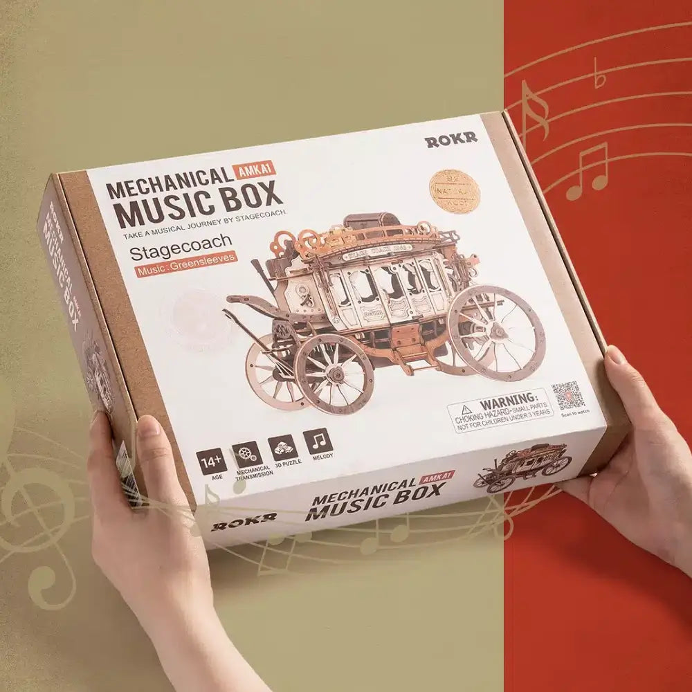 Ambalajul puzzle-ului 3D Diligenta ROKR Mechanical Music Box cu modelul de trasura din lemn si mențiunea melodiei Green Sleeves